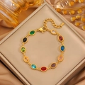 Bracelet élégant en acier titane doré avec pierres colorées sur un coffret à bijoux - Bracelet en Zirconium Arc-en-Ciel Or