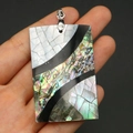 Macro detail of rectangular abalone shell pendant with rainbow sheen and silver clasp - Rectangle Style (38x43mm)