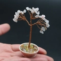 Miniature pink crystal life tree ornament held in hand for scale comparison - Rose Quartz