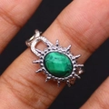 Macro shot of oval green gemstone ring with a vintage woven stainless steel band - Malachite