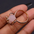 Macro view of pink hexagonal stone ring with golden bee detail and adjustable band - Rose Quartz