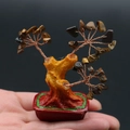 Mini arbre à argent en cristal avec pierres œil de tigre tenu en main pour taille - Œil de tigre