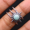 Silver stainless steel ring with sunburst design and blue natural stone on finger - Amazonite