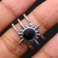 Silver stainless steel ring with black sunburst stone shown on finger as worn - Black Agate