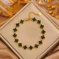 Detailed macro view of a gold-plated four-leaf clover bracelet with green zircon inlay - Gold Clover Green Zirconia Bracelet