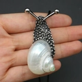 Silver snail-shaped natural shell necklace pendant with intricate metallic texture - White-mouth Shell Necklace / 20-60mm, 11-17g / Silver