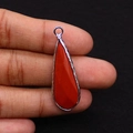Detailed view of teardrop red jasper stone pendant held in hand for scale and size check - 12x38mm 4g/pc / Red Jasper