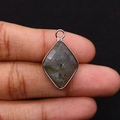 Rhombus labradorite stone pendant with rose gold border held by fingers for size - 15x25mm 3g/Item / Labradorite