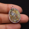 Oval natural stone pendant with brown mottled texture and rose gold plated edging - 17x26mm / African Turquoise