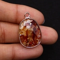 Oval natural stone pendant with faceted red-brown agate and rose gold plated frame - 17x26mm / Fire Agate