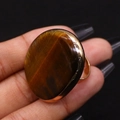 Adjustable gold plated ring featuring a large oval tiger eye stone with retro aesthetic - 30x41mm / Tiger's Eye