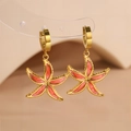 Boucles d'oreilles étoile de mer françaises en acier doré et émail orange élégant - Étoile de mer / Orange