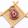 Detailed view of striped natural agate pendant with vintage hammered metal plating edges - Reddish Brown Natural Stone Style (No. 1)