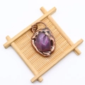 Close-up of vintage purple faceted agate stone pendant with copper plated lava edge - Purple Crystal Stone Style (No. 2)
