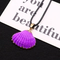 Macro detail of purple shell pendant with gold electroplated edges and black braided cord - Purple Style (5)