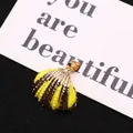 Natural yellow sea shell snail pendant with electroplated gold edge and metal loop - Bright Yellow
