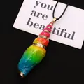 Macro detail of rainbow gradient spiral seashell pendant with elegant gold plated trim - 20-60mm / Rainbow (Without Rope)