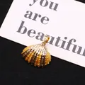 Golden plated seashell pendant with vertical stripes and metallic gold finish for DIY jewelry - Silver White Texture