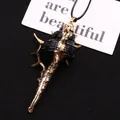 Natural conch shell pendant in black and gold with a metallic edge and black cord - Conch Pendant With Cord / Black Gold (No. 5)