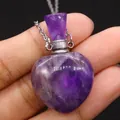 Detailed macro shot of a heart-shaped purple amethyst essential oil perfume bottle pendant - 23x36mm, 15g / Purple Crystal