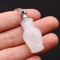 Macro shot of rose quartz perfume bottle pendant necklace with silver chain - White Crystal