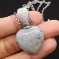 Natural heart-shaped gemstone perfume bottle pendant with silver chain held in hand - 23x36mm, 15g / Flash Stone (Labradorite)