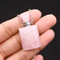 Macro detail of natural rose quartz crystal perfume bottle pendant on a silver chain - 19x37mm,18g / Rose Quartz