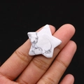 Close-up of a star-shaped polished white howlite stone with natural grey veins - 30mm (Thickness 8mm) / Howlite