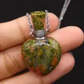 Hand holding a heart-shaped Unakite natural stone perfume bottle pendant with silver chain - 23x36mm, 15g / Unakite