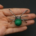 Detailed macro view of spider-shaped natural stone pendant with green gem and silver legs - 34x47mm, 14g / Green Style (11)