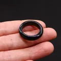Polished black agate stone ring band for minimalist style jewelry on a dark background - Black Agate