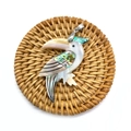 Macro shot of bird pendant with white shell and colorful abalone shell on woven mat - Bird Style 8 (1014-B210215004)