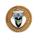 Detailed view of an owl pendant made of abalone shell and white mother of pearl on a mat - Owl Style 5 (1014-B210215004)