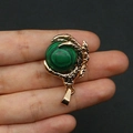 Dragon claw pendant in gold-plated finish holding a green malachite stone ball - Malachite