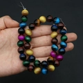 Macro detail of mixed color round glass beads with tiger eye texture for DIY jewelry making - No. 9 (Mixed Color)