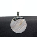 Natural round mother of pearl pendant with ornate silver bail on black textured surface - 60mm / No.3 Carved Bail Style (1014-B210215013)