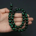 Detailed view of dark green tiger eye glass beads with cat-eye effect for jewelry making - No. 7 (Dark Green)
