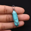 Detailed macro view of handmade copper wire wrapped turquoise hexagonal crystal pendant - 10x40mm / Blue Turquoise