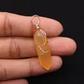 Macro detail of handmade wire wrapped orange crystal hexagonal prism stone pendant - 10x40mm / Orange (No. 6)