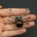 Silver spider-shaped pendant with a round brown gemstone inlay and detailed insect joints - 34x47mm, 14g / Tiger's Eye