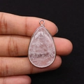 Macro shot of a teardrop pink quartz pendant with gold electroplated edges held by hand - 21x35mm(8g/pc) / White Crystal
