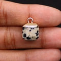 Macro detail of cube-shaped Dalmatian Jasper pendant with rose gold bail connector - 10x15mm 3g Per Piece / Dalmatian Jasper