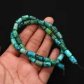 Vue macro de perles cylindriques en pierre turquoise impériale pour bijoux DIY - 6x10mm, 24g / N°12 (Tacheté Bleu Cyan)