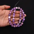 Detailed view of star-shaped purple stone beads with golden marble veins on hand - 10x10mm (4mm Thickness) / Purple Gold Veins (No. 12)