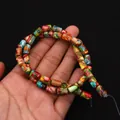 Vue macro de perles cylindriques en jaspe impérial multicolore pour bijoux DIY - 6x10mm, 24g / N°10 (Mosaïque Multicolore)