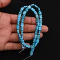 Macro-opname van turquoise strikvormige kralen met minerale aders voor DIY-sieraden - Hemelsblauwe Textuur (Nr. 5)