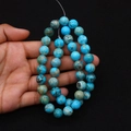 Close-up of polished turquoise marble beads with natural patterns for DIY jewelry - Sky Blue Light Green (No. 27)