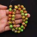 Macro detail of colorful imperial stone round beads with natural marble crackle patterns - Multicolor Cracked (No. 12)