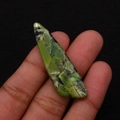Macro shot of an irregular green emperor stone pendant with black veins and hanging hole - 13x45mm / Fruit Green with Black Spots