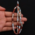 Colorful cylindrical imperial stone tube beads for DIY jewelry making displayed on hand - 4x8mm / Size 13